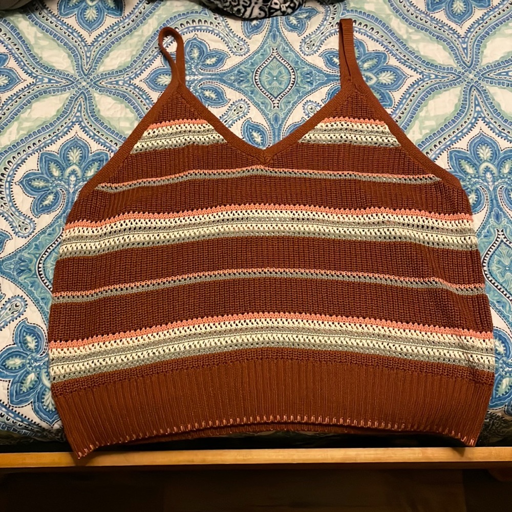 Baggy nit tank top with the colors brown, light pink, sage green and white.